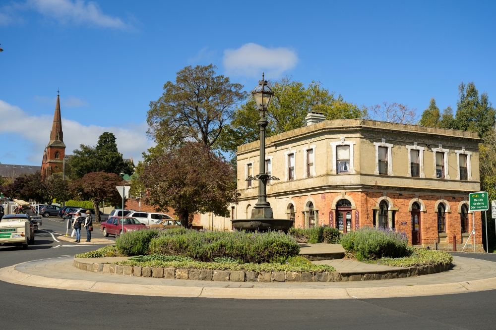 A roundabout with heritage buildings on the corner