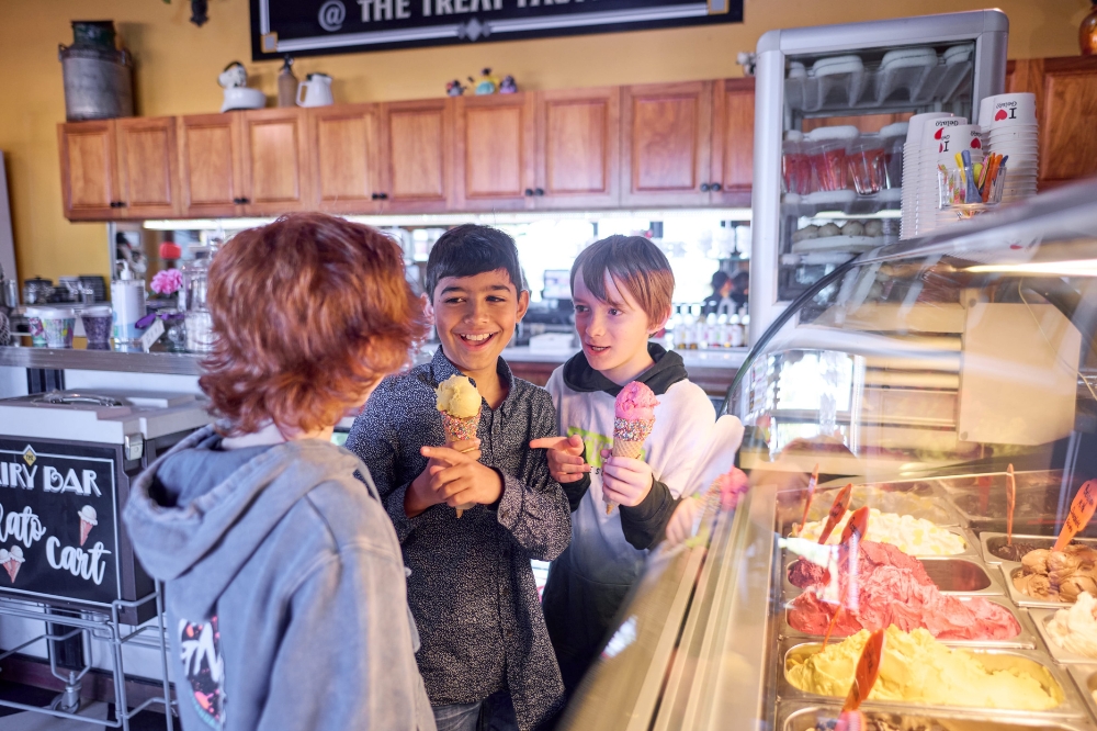 Kids holding ice cream and smiling