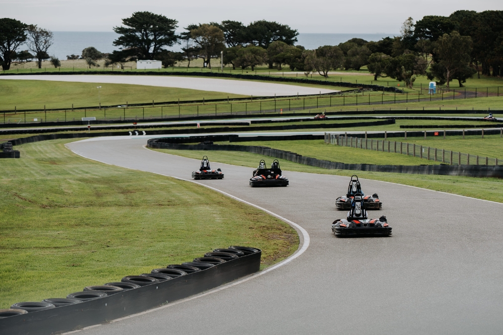 Go carts race along a track