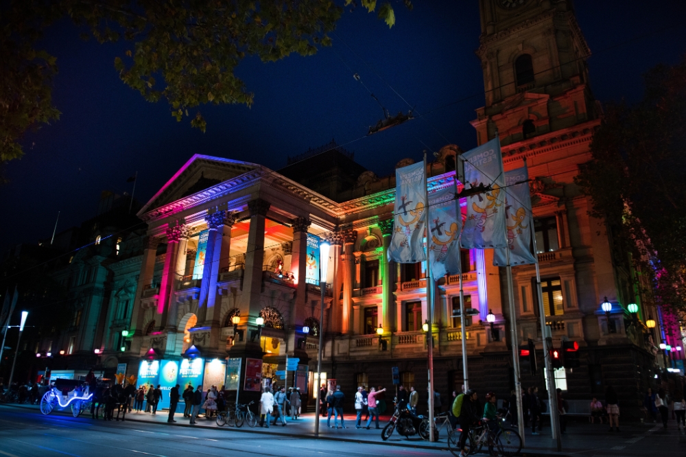 Melbourne town hall at night with colours projected onto the building